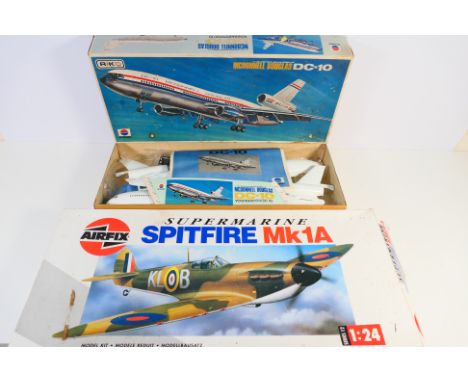 Airfix - Nitto Kagaku - Two boxed plastic model aircraft kits. Lot consists of a 1990's Airfix #12001 1:24 Supermarine Spitfi
