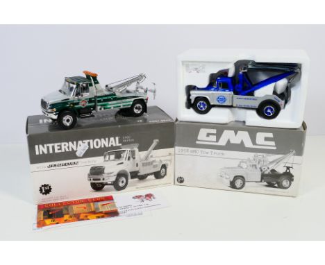 First Gear - Two boxed First Gear 1:34 scale diecast tow trucks. Lot consists of #19-2906 International 4400 Series with Jerr