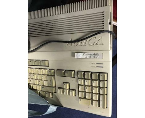 AMIGA COMMADOR A-500 CONSOLE with many floppy disc games and a joystick 