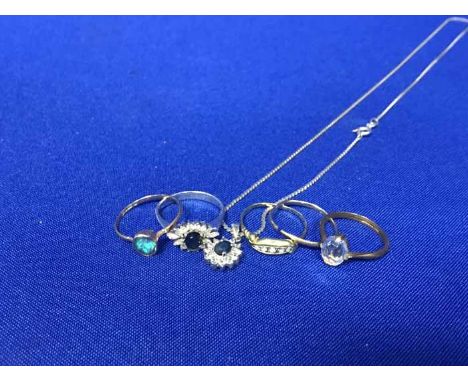 DIAMOND AND GOLD BOAT SHAPED RINGalong with four other rings and a pendant on chain