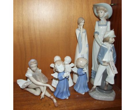 A Lladro figure of a young boy holding a toy yacht, 23cm high, another of a ballerina seated, (a/f), two Nao female figures a