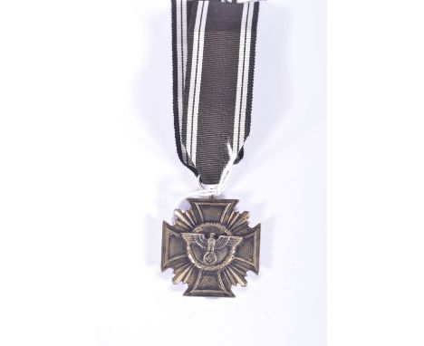 A WW2 NSDAP LONG SERVICE MEDAL, this was awarded for ten years' service in the Nazi party, The Ribbon and ring appear new and