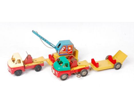 Wells and Brimtoy Tinplate and Clockwork Low Loader Group, 2 examples, 1 with Age Construction Tracked Lifting Crane, 1 missi