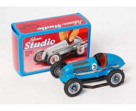 Schuco, No.1062 1936 Mercedes Grand Prix racing car, blue body with brown seat and racing number 3, in the original red and b