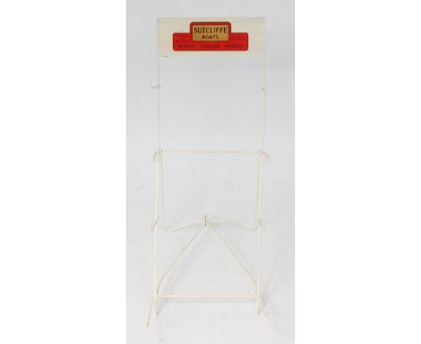 Sutcliffe Models, shop display stand,of metal wire construction with headboard to read 'Sutcliffe Boats - World Famous Models