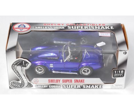 Shelby Collectibles, 1/18th scale boxed as issued Shelby Super Snake, finished in metallic dark blue, in the original window 