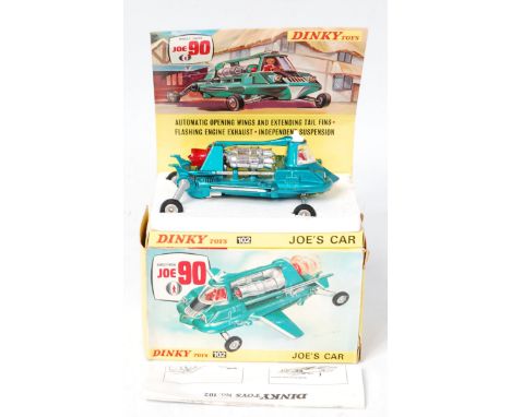 Dinky Toys, 102 Joe's Car, metallic green/blue body, red driver, on styrafoam tray of diorama sliding tray, with instruction 