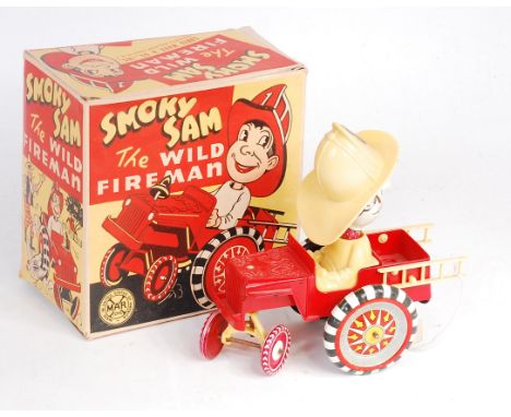 Marx Toys, tinplate and plastic Fire Engine, comprising of red plastic engine with yellow ladders, tinplate detailed wheels, 