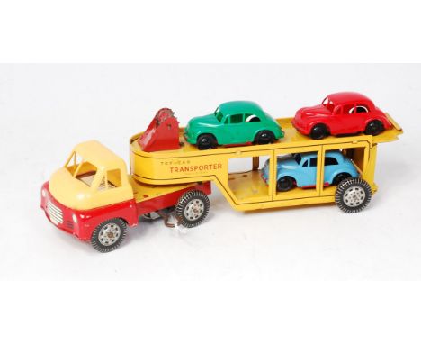 Wells-Brimtoy clockwork Articulated, Toy Car Transporter with Bedford Type cab, cab having red chassis and yellow plastic roo