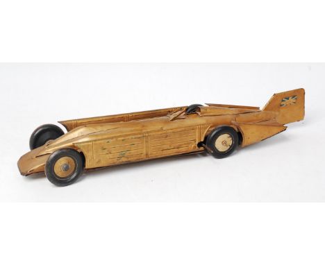Gunthermann Golden Arrow, Tinplate and Clockwork model of the famous Land Speed Record Holder, Gold Body with black balloon t