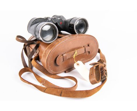 A pair of WWII Canadian Army binoculars, marked with broad arrows and "REL CANADA 1944", in their original leather case. Exte