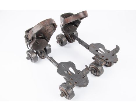 A pair of vintage roller skates, steel bodies marked "Gloria" and "Helios", original leather straps and heel guards. GC £30-4