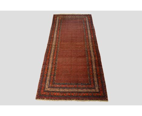Saraband kelleh, north west Persia, early 20th century, 12ft. 11in. x 5ft. 9in. 3.94m. x 1.75m. Overall wear; patch top right