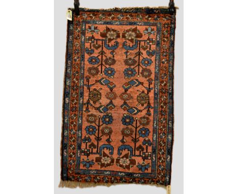 Three north west Persian rugs, about 1930s, comprising Hamadan rug, floral design on a soft red field, 3ft. 10in. x 2ft. 4in.