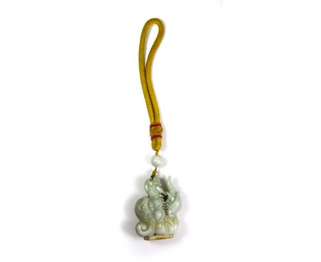A superb Chinese carved jadeite jade amulet of a dragon with contrast amber coloured bat and Imperial yellow silk cord, drago