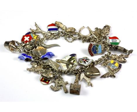 A silver and enamel charm bracelet.