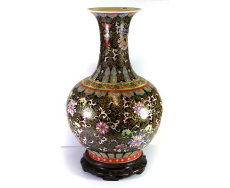 A large Chinese hand enamelled porcelain vase, H.55cms 4 character marked to base. (early to mid 20th century with hardwood s