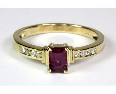 A pretty 9ct yellow gold (stamped 375) ruby and diamond set ring (M.5).