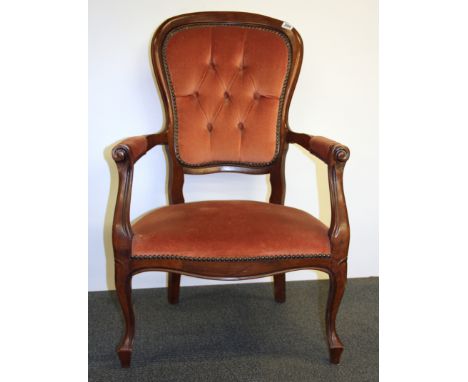 A button back mahogany armchair.