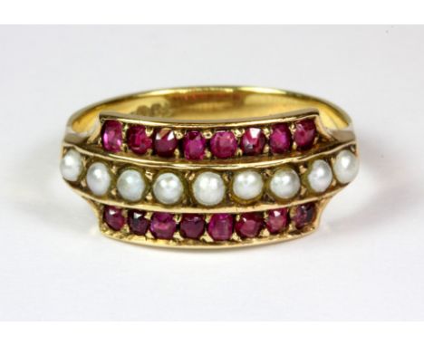 An 15ct gold ruby and seed pearl set ring (N).