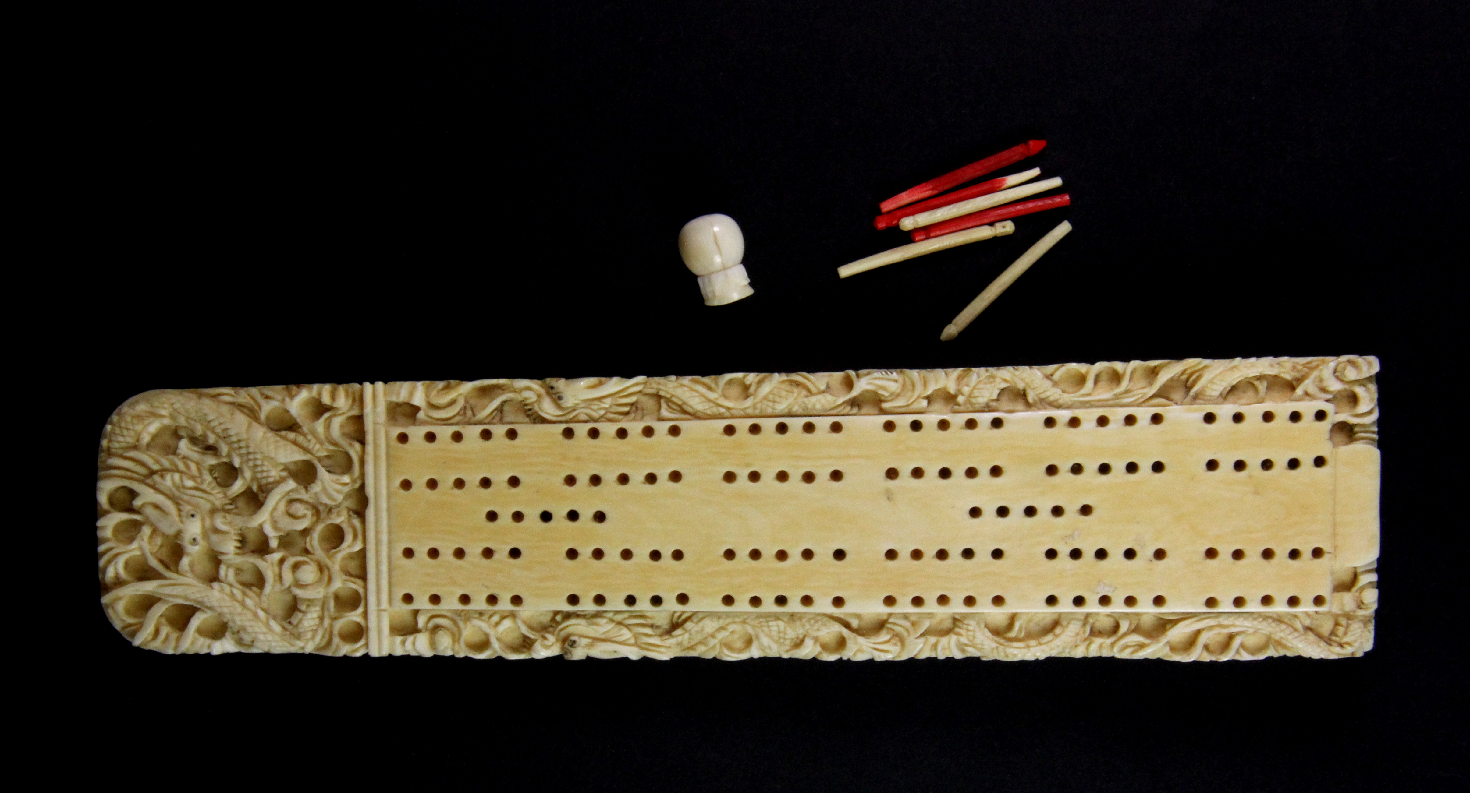 A 19th century Chinese carved ivory cribbage score board, L.19cms with ...