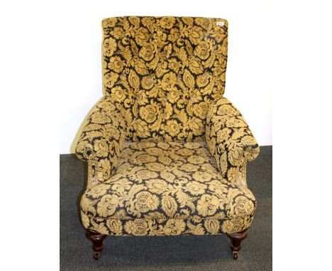 An early 20th century button backed armchair.