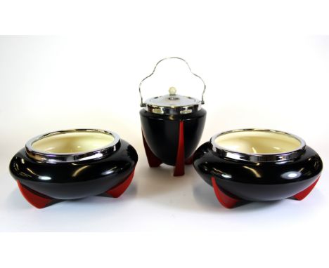 Seven Wilkinson Clarice Cliff design ceramic items including two biscuit barrels, two fruit bowls and three preserve pots.