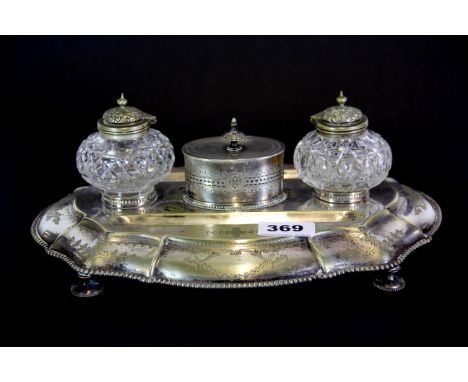 A 19th century silver plate and glass desk stand, W. 30cm.