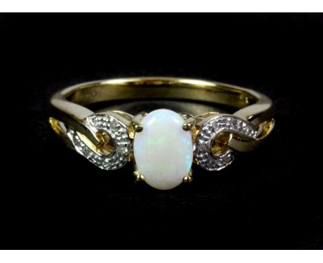 A 9ct yellow gold opal and diamond set ring, (N).