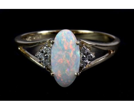 A 9ct yellow gold opal and diamond set ring, (P.5).