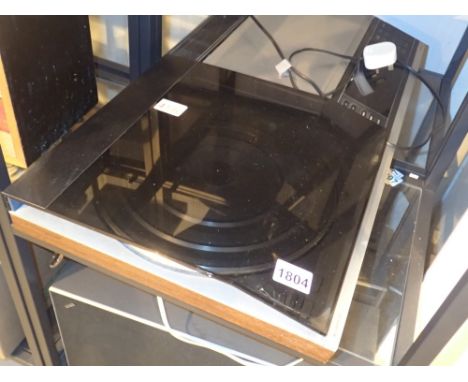 Bang and Olufsen Beocenter with speakers and remote CONDITION REPORT: Stylus present  and removed to office. We cannot clarif