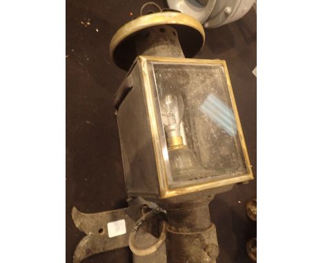 Electrically converted antique coaching lamp with hanging bracket