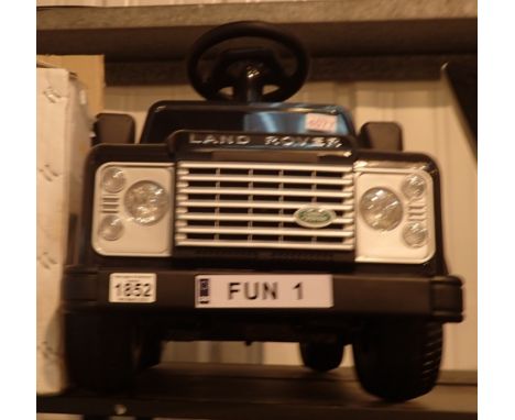 Boxed Kids at Play Land Rover Defender battery powered with charger CONDITION REPORT: This item is fully working at lotting.