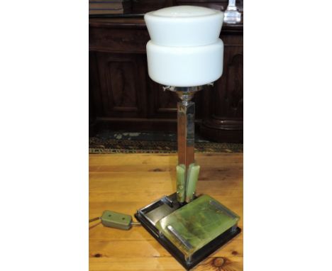A 1950's Art Deco style onyx and chrome table lamp combined cigarette case with opaque glass shade on part galleried Bakelite