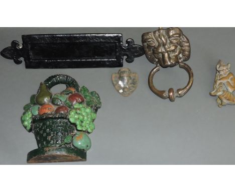 Items of door furniture including a brass lion's head door knocker