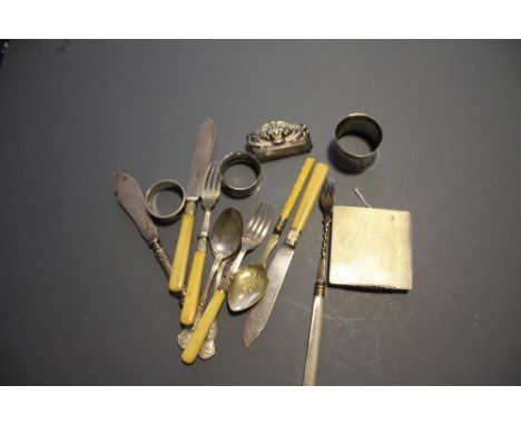 A Continental white metal compact with cast floral thumbpiece together with 2 silver serviette rings, 2 others and a quantity