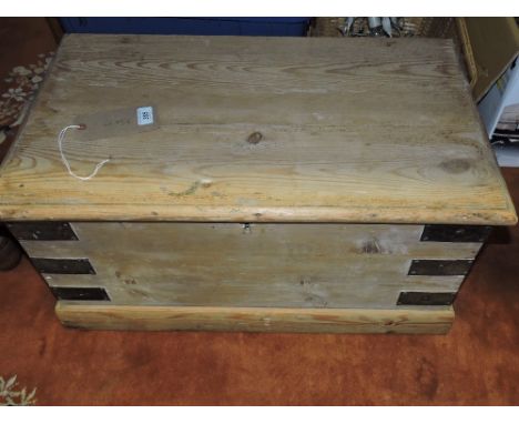 A Victorian iron bound rectangular pine trunk.