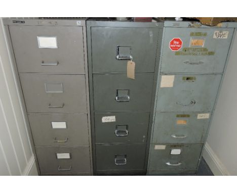 Three vintage grey metal four drawer filing cabinets, one by Triumph.