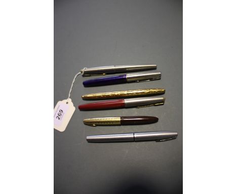 Five vintage Sheaffer and Parker fountain pens and two Meerschaum style pipes.