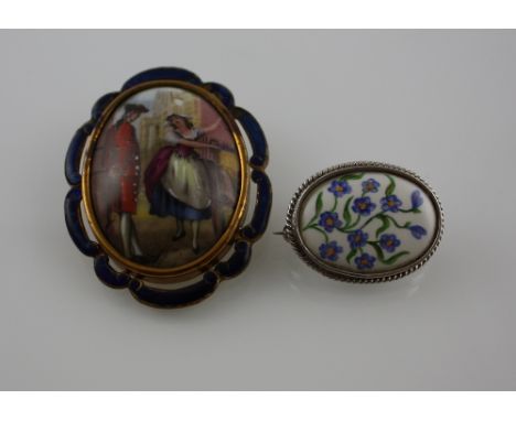 An early 20th Century oval enamelled brooch decorated with a lady and gallant, marked TLM England, together with a silver mou
