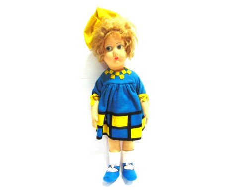 A LENCI STYLE CLOTH DOLL  with a short blonde wig, and painted side-glancing eyes and other facial features, on a jointed bod