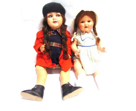 TWO COMPOSITION DOLLS  comprising a Kammer &amp; Reinhardt doll, the celluloid head with a plaited brown wig, blue-grey glass