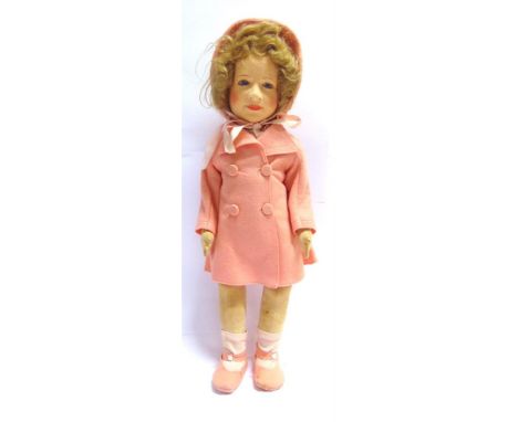 A CHAD VALLEY PRINCESS ELIZABETH CLOTH DOLL  with a blonde wig and inset blue glass eyes, on a jointed body, wearing a pink f
