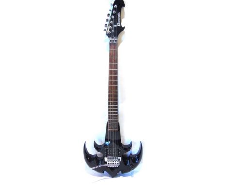 A DIMAVERY AXE-STYLE ELECTRIC GUITAR  the solid body with a licensed 'Floyd Rdse' tremolo system, 98cm high.