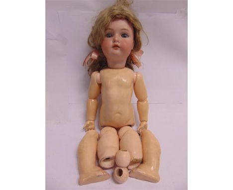 A SIMON &amp; HALBIG FOR KAMMER &amp; REINHARDT BISQUE SOCKET HEAD DOLL  with a long blonde wig, sleeping blue glass eyes, pi