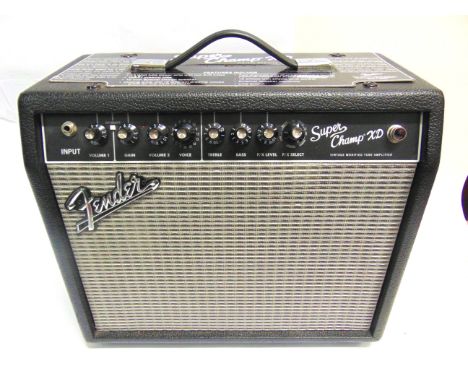 A FENDER SUPER CHAMP XD GUITAR AMPLIFIER  with 20 watts output, twin channels, sixteen voices, and five effects, 38cm high, 4
