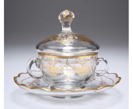 A GILDED CUP, COVER AND SAUCER, 19TH CENTURY he two-handled bowl gilt decorated with flowers, leaves and swags, the domed lid