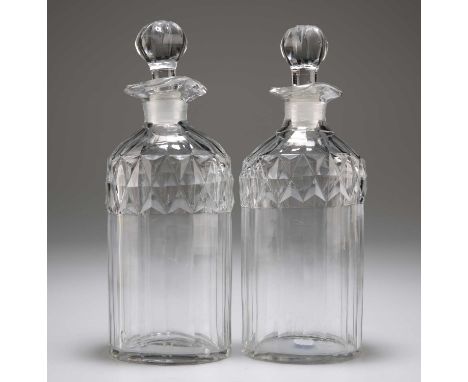 A PAIR OF GLASS SPIRIT DECANTERS WITH STOPPERS, CIRCA 1880 each panelled oval body with diamond cutting to the shoulder. 20.5