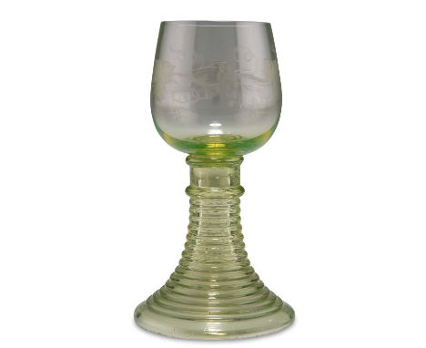 A BOHEMIAN LIGHT GREEN GLASS ROEMER, CIRCA 1890 the bowl engraved with grapes and vines, raised on a tapering spiral stem foo