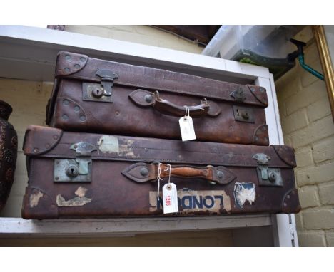 Two vintage leather suitcases, largest 77cm wide. 